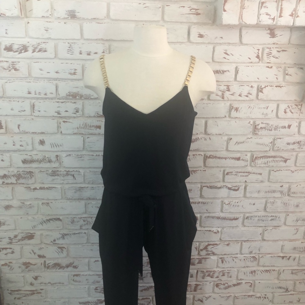 Michael Kor’s Slim Jumpsuit with Gold Chain Straps